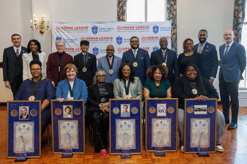 MLK Honorees people sit with awards